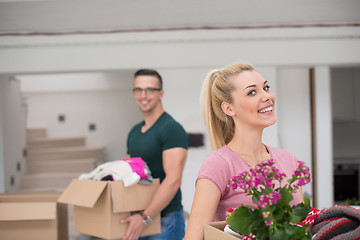 Image showing young couple moving into a new home