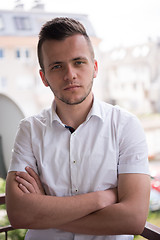 Image showing man standing at balcony