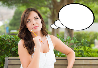 Image showing Thoughtful Young Woman with Pencil and Blank Thought Bubble.
