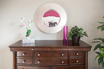 Image showing Beautiful Dresser and Mirror Against a Wall in a Home.