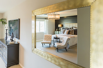 Image showing Beautiful Bedroom Reflection in Decorative Mirror.