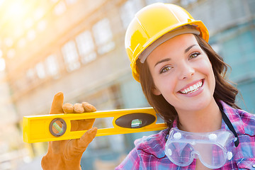 Image showing Portrait of Young Female Construction Worker with Level Wearing 