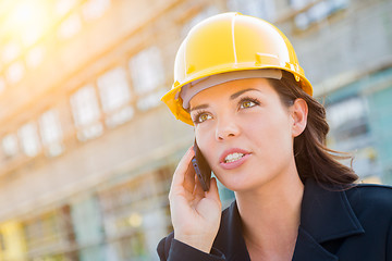 Image showing Young Professional Female Contractor Wearing Hard Hat at Contruc