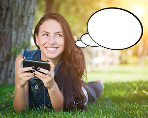 Image showing Thoughtful Young Woman with Cell Phone and Blank Thought Bubble.