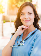 Image showing Portrait of Young Adult Female Doctor or Nurse Wearing Scrubs an
