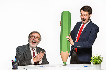 Image showing The two colleagues working together at office on white background.