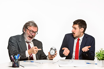 Image showing The two colleagues working together at office on white background.