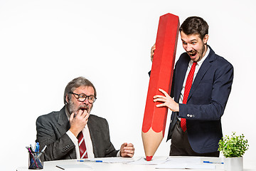 Image showing The two colleagues working together at office on white background.