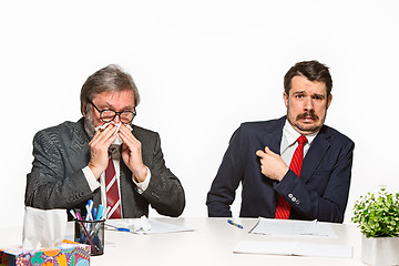 Image showing The two colleagues working together at office on white background.