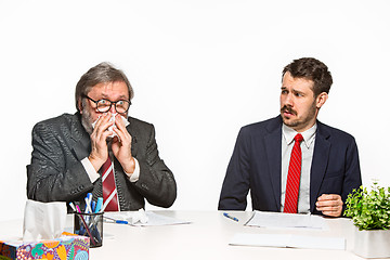 Image showing The two colleagues working together at office on white background.