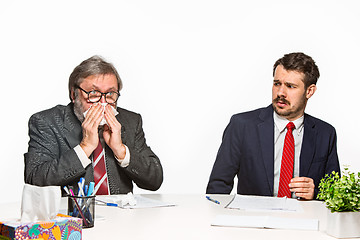 Image showing The two colleagues working together at office on white background.