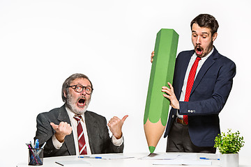 Image showing The two colleagues working together at office on white background.