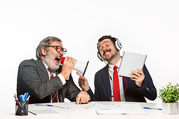 Image showing The two colleagues working together at office on white background.