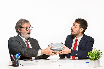 Image showing The two colleagues working together at office on white background.