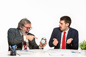 Image showing The two colleagues working together at office on white background.