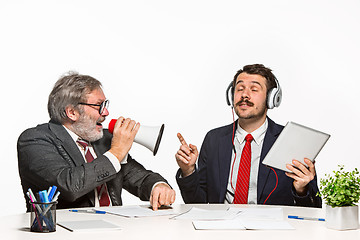 Image showing The two colleagues working together at office on white background.