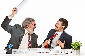 Image showing The two colleagues working together at office on white background.