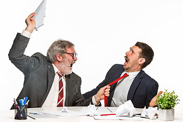 Image showing The two colleagues working together at office on white background.