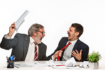 Image showing The two colleagues working together at office on white background.