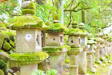 Image showing Old stone lanterns in Nara. Selective focus.