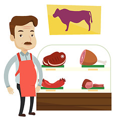 Image showing Butcher offering fresh meat in butchershop.