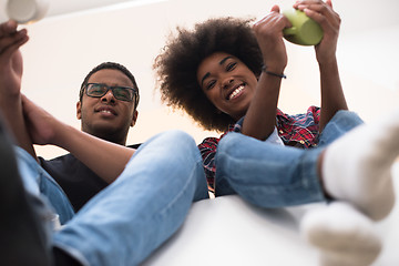 Image showing couple having break during moving to new house