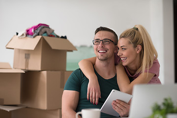 Image showing Young couple moving in a new home