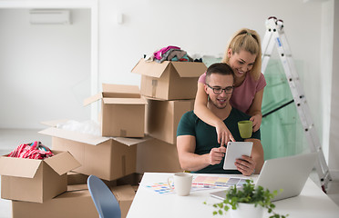 Image showing Young couple moving in a new home