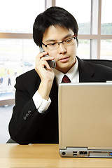 Image showing Working asian businessman