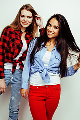 Image showing best friends teenage girls together having fun, posing emotional on white background, besties happy smiling, lifestyle people concept, blond and brunette multi nations 