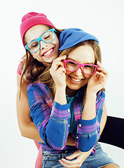 Image showing lifestyle people concept: two pretty stylish modern hipster teen girl having fun together, happy smiling making selfie