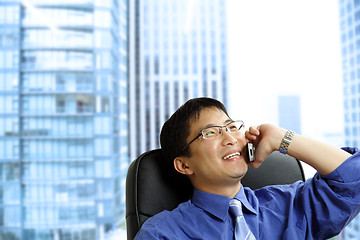 Image showing Asian businessman on the phone