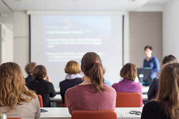 Image showing Woman giving presentation in lecture hall at university.