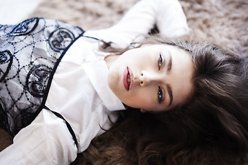 Image showing young pretty woman in her bedroom sitting in chair, lifestyle people concept