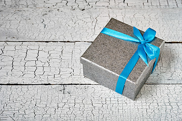 Image showing Gift box with blue ribbon