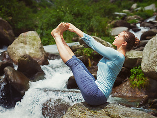 Image showing Woman doing Ashtanga Vinyasa Yoga asana outdoors