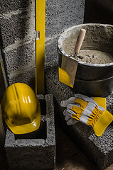 Image showing Tools for bricklayer bucket with a solution and a trowel, close-