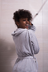 Image showing beautiful black woman wearing  bathrobe