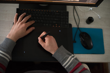 Image showing graphic designer at work top view