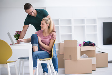 Image showing Young couple moving in a new home