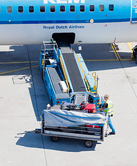 Image showing AMSTERDAM, NETHERLANDS - AUGUST 17, 2016: Loading luggage in air