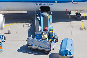 Image showing AMSTERDAM, NETHERLANDS - AUGUST 17, 2016: Loading luggage in air