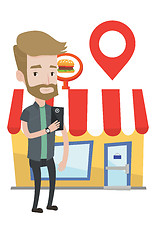 Image showing Man looking for restaurant in his smartphone.