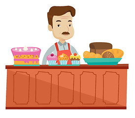Image showing Worker standing behind the counter at the bakery.