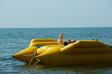 Image showing two happy kids playing on the boat at summer day