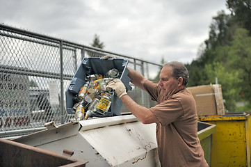 Image showing Recycle Center - Man recycling glass