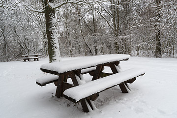 Image showing Snow covered benches and tables