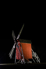 Image showing Illuminated old traditional windmill in Sweden