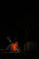 Image showing Illuminated wooden windmill, iconic symbol for the island Oland 