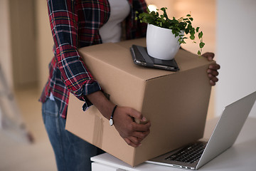 Image showing Black girl moving in the new apartment